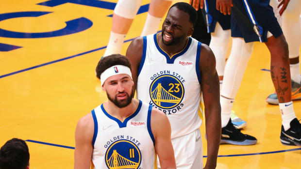 May 20, 2022; San Francisco, California, USA; Golden State Warriors guard Klay Thompson (11) and forward Draymond Green (23) react after Thompson is called for a foul against the Dallas Mavericks during the second quarter of game two of the 2022 western conference finals at Chase Center. Mandatory Credit: Kelley L Cox-USA TODAY Sports